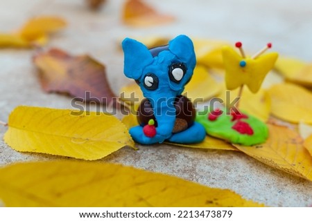 Children hand made autumn decoration from plasticine, elephant from chestnuts. beautiful animal