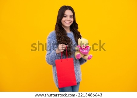 Teenager hold shopping bag enjoying sale. Child girl is ready to go shopping. Happy teenager, positive and smiling emotions of teen girl.