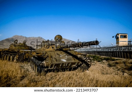 War in Afghanistan. The road to Jalal-Abad in Afghanistan and the cemetery of military equipment