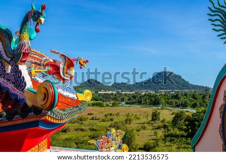 Chinese dragon statue on a roof of a temple in District Chonburi Thailand Southeast Asia