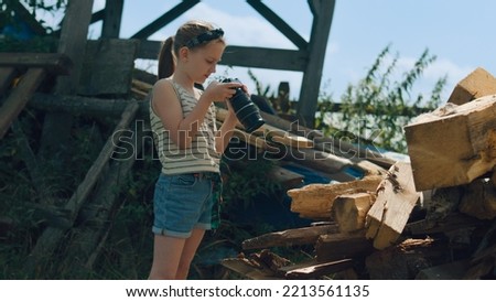 Young photographer shooting wooden pattern. Girl taking macro pictures of amazing nature, upgrading photography skills, spending leisure time outdoor