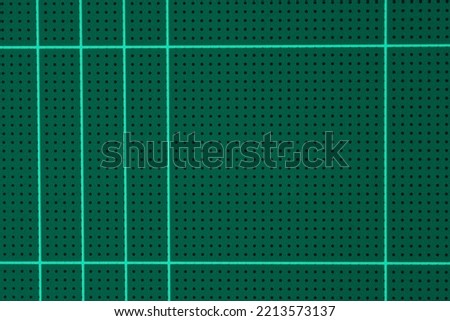 rubber green cutting mat sheet with grid guide line scale square shape background.idea for paper tools,school or graphic craft studio equipment backdrop design.