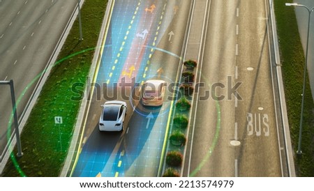 Following Aerial Top Down Drone View: Autonomous Self Driving Car Moving Through City Highway, Overtaking Other Cars. Visualization Concept: Sensor Scanning Road Ahead for Vehicles, Speed Limits