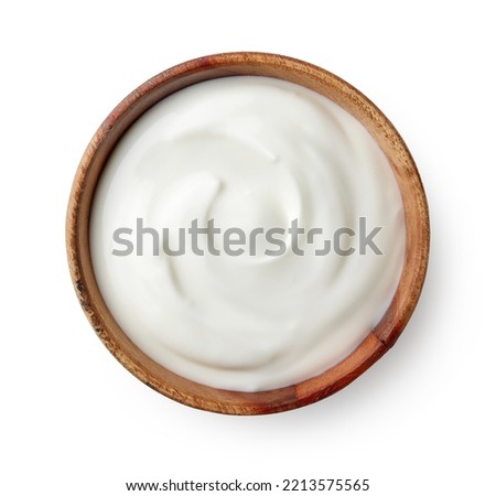 Wooden bowl of fresh greek yogurt isolated on white background, top view Royalty-Free Stock Photo #2213575565