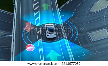 Following Aerial Drone View: Autonomous Self Driving Car Moving Through Megapolis City Highway. Visualization Concept: Sensor Scanning Road Ahead for Vehicles, Danger, Speed Limits. Day Urban Driveway