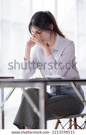 Asian indian women are stressed while working on laptop, Tired asian businesswoman with headache at office, feeling sick at work copy space in workplace an home office.	 Royalty-Free Stock Photo #2213598515
