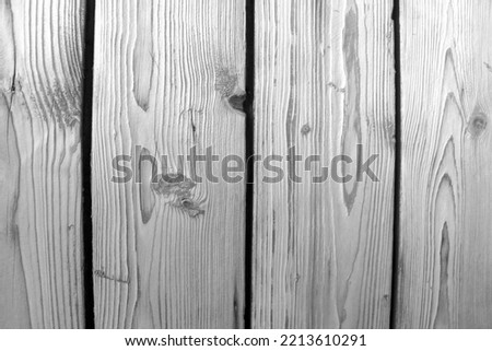 Black and white photo. Wood texture, old fence