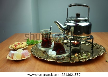 Turkish tea, Arabic black tea set with cardamom, mint, and dessert