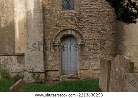 An ancient door at the Church of St Mary in the pretty village of Duddington in Northamptonshire England UK