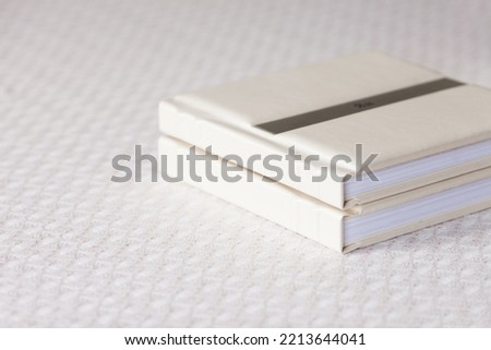 Photo book with leather cover. Stylish wedding or family photo album. Beautiful notepad or photobook with elegant embossing. Printing products. Individual products. Details
