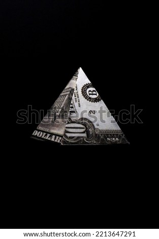 pyramid shape made of dollars isolated on black background