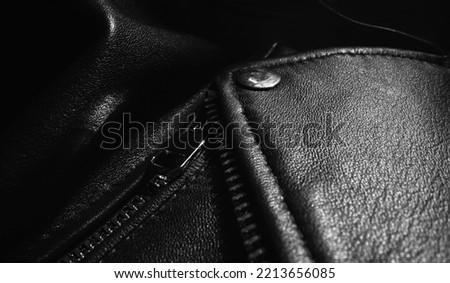 Black leather jacket details. Close-up. Royalty-Free Stock Photo #2213656085