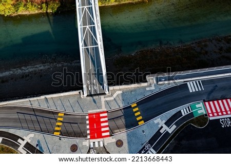 aerial view of bridge with bike path and road signs