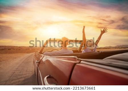 happy people traveling in classic vintage car, couple during honeymoon Royalty-Free Stock Photo #2213673661