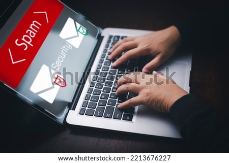 Email concept with laptop spam and virus computer monitor internet security concept, businessman reading electronic mail with a laptop. Spam, junk and e-marketing on screen, Spam Email Pop-up Warning.
