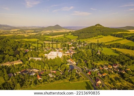 Aerial view of village Milesov near Milesovka mountain. Bohemian countryside with castle in countryside. Czech republic, European union.