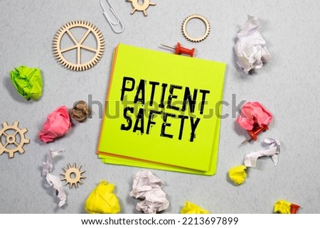 Patient Safety word written on wood block. Patient Safety text on white table.