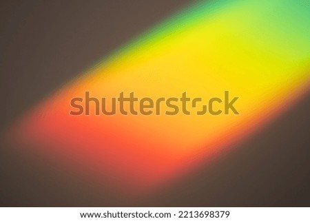 Rainbow light on dark background. Beautiful backdrop for design projects. Fantasy overlay wallpaper. Abstract multicolored photo. Creative backplate for cosmetics, beauty products. Freedom concept