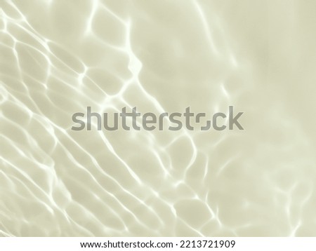 Closeup​ blur​ abstract​ of​ surface​ blue​ water. Abstract​ of​ surface​ blue​ water​ reflected​ with​ sunlight​ for​ background.Top​ view​ of blue​ water.​ Water​ splashed​ use​ for art​ pattern.