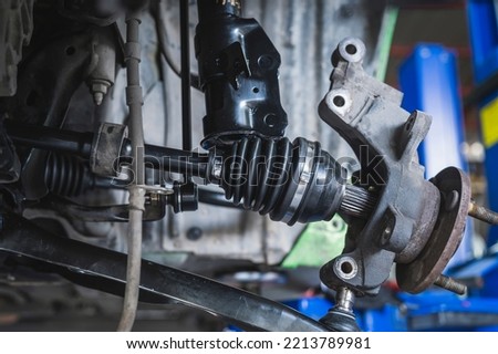 CV Axles replacement on a front wheel drive car. Royalty-Free Stock Photo #2213789981