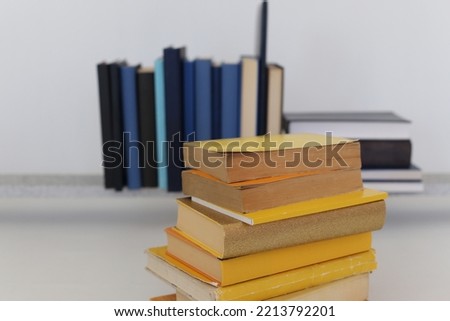 Yellow and blue books on a white background