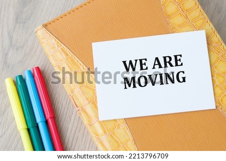 Business concept. A card with the inscription - we are moving