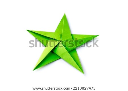 Green paper star origami isolated on a blank white background.