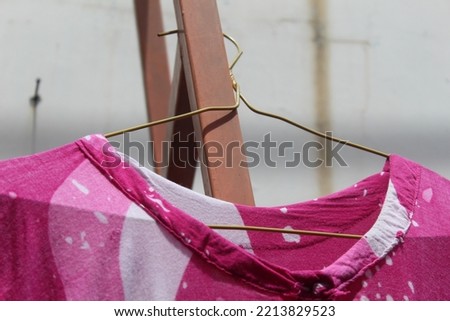 Close up of clothes in the drying line on a clothesline on a hot day. illustration of laundry at home