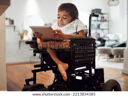 Wheelchair, disability and child with tablet for learning, video or games in home. Cerebral palsy, boy and disabled use tech on internet, app or web for development of brain, mind and education