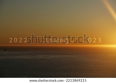 Landscape sunrise morning scene with Loading 2022 to 2023 letters on the Sea twilight color , End of year 2022 and Happy new year 2023 concept - abstract background 