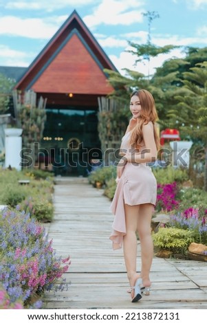 Beautyful Asian woman in the flower garden