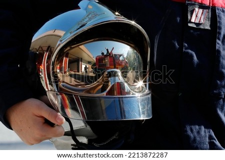 Fire department.  Firefighter and helmet. French Sapeurs Pompiers. France.  Royalty-Free Stock Photo #2213872287