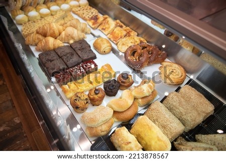 Picture of a Lot of Sweet Croissants and Some Dessert in Supermarket Bakery