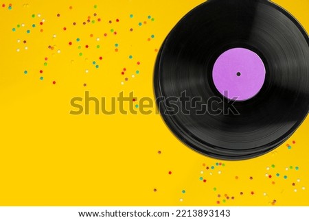 Vinyl records, party music, top view. Empty copy space for record label mockup. Vintage retro sound recording style. Background for the design of a poster, postcard, and flyer for music events. Royalty-Free Stock Photo #2213893143