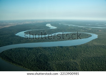 Beautiful view to Iguazu River on green rainforest area, Paraná, Brazil Royalty-Free Stock Photo #2213900985