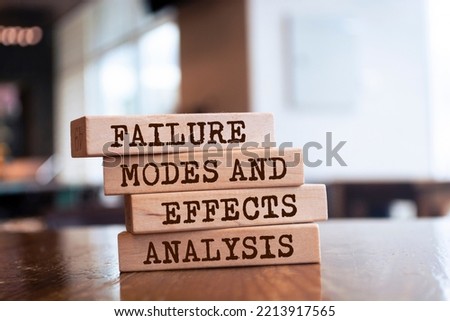 Wooden blocks with words 'Failure Modes and Effects Analysis'. -FMEA Royalty-Free Stock Photo #2213917565