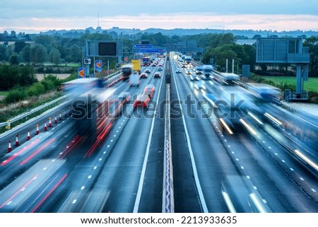 heavy traffic in blurry motion on UK motorway in England Royalty-Free Stock Photo #2213933635