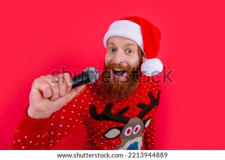 christmas music party. happy man at christmas music party with microphone. christmas santa man