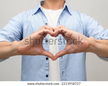 Close up man make hands heart for lover studio shot portrait