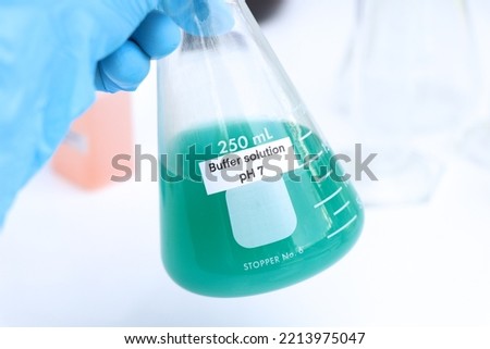 Buffer solution in glass, chemical in the laboratory and industry, Chemicals used in the analysis Royalty-Free Stock Photo #2213975047