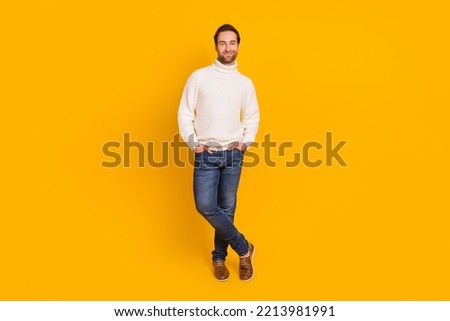Photo of positive guy hands pockets posing wear white pullover jeans shoes isolated yellow color background Royalty-Free Stock Photo #2213981991