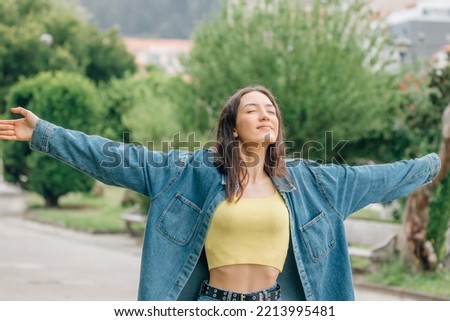 girl breathing deeply outdoors, relax Royalty-Free Stock Photo #2213995481