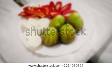 Blurry photo still life plate with portions of food