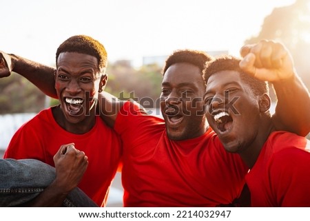 African football fans having fun supporting their favorite team - Sport entertainment concept Royalty-Free Stock Photo #2214032947