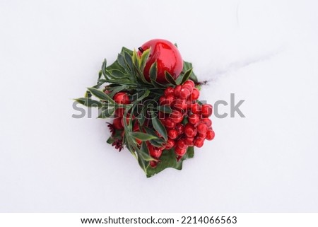 Christmas tree decorations on a white background. White snow, winter day. Christmas holiday card and frame. christmas wreath, green and red colors.
