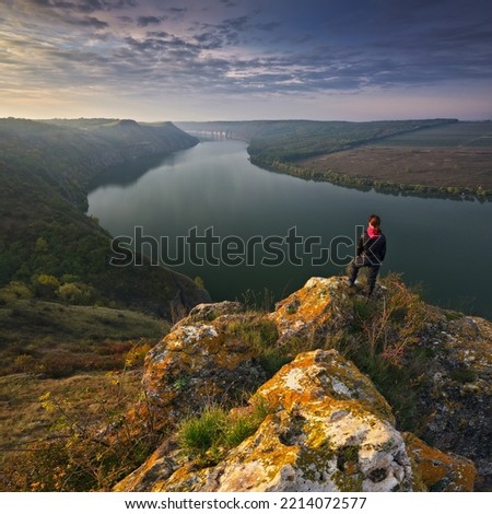 Young woman enjoying the beauty of nature in a picturesque canyon. Landscape of Ukraine