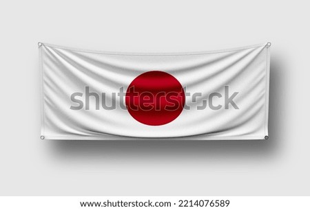 Japan flag hangs on wall, white background