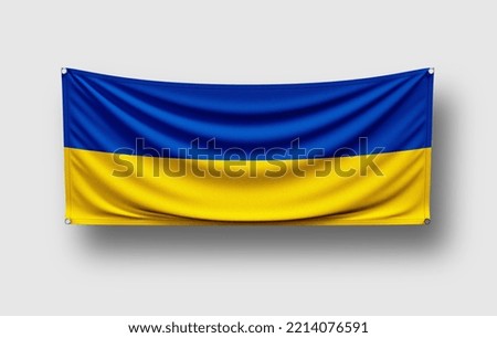 Ukraine flag hangs on wall, white background