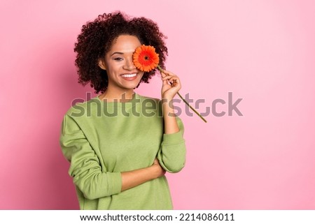 Photo of young cheerful girl cover eye flower present botanical 8-march isolated over pink color background