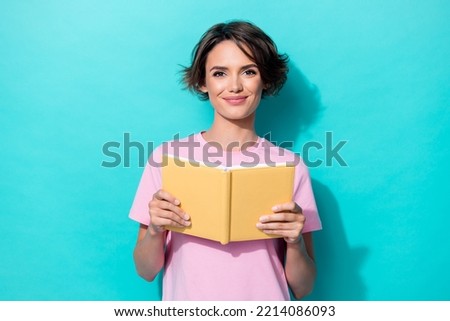 Portrait photo of young cute pretty woman wear pink t-shirt hold yellow book diary nerd isolated on cyan color background